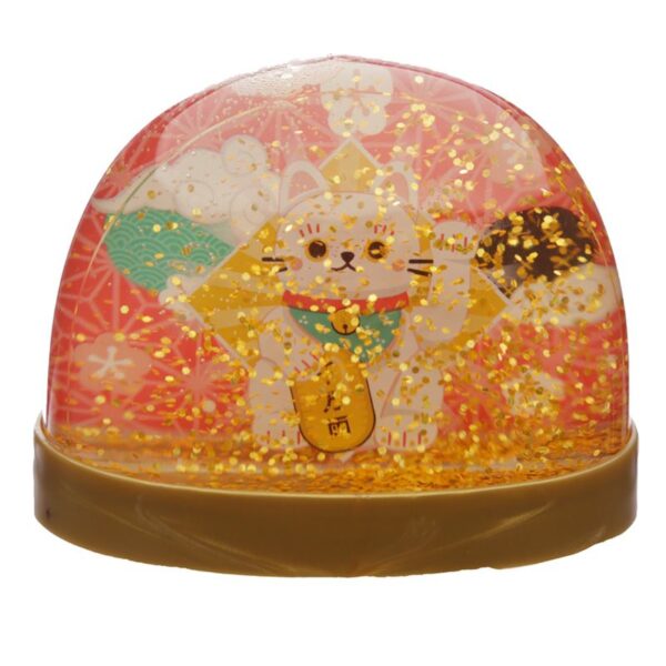 Palla con neve dorata gatto maneki bianco, neve che cade